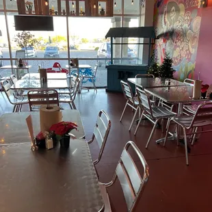  tables and chairs in a restaurant