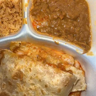 a plate of food with rice, beans, and a burrito