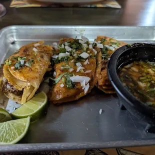 Birra quesadilla but looks like tacos. They were delicious and the consomé was quite lovely