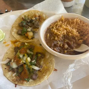 Steak tacos, rice and beans