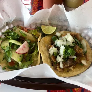 Veggie and carnitas tacos