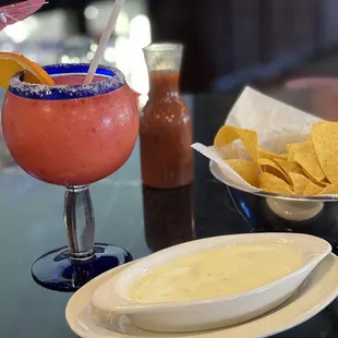 Queso, chips, and Frozen Strawberry Margarita