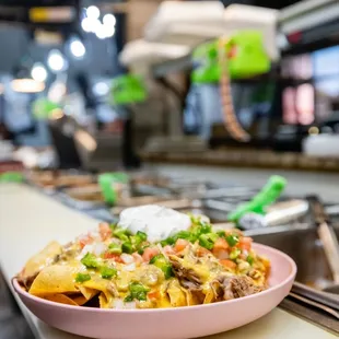 a plate of nachos on a counter