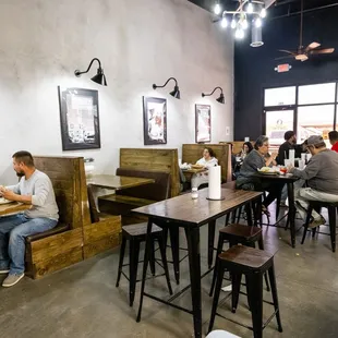 people sitting at tables and eating