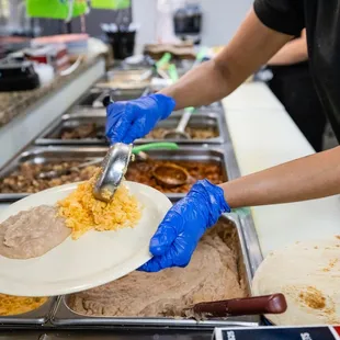 a person serving food to a customer