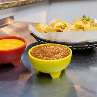 a bowl of chili and a bowl of tortilla