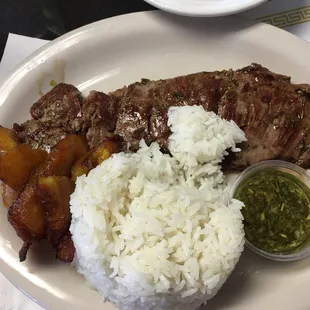 Fried Plantain, rice, and skirt steak. Owesome