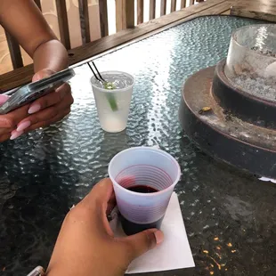 a woman holding a cup of wine