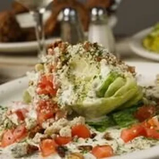WEDGE SALAD WITH BLUE CHEESE AND BLUE CHEESE CRUMBLES