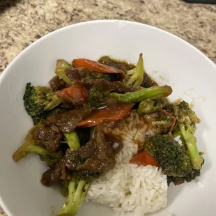 Beef and broccoli over steamed rice.