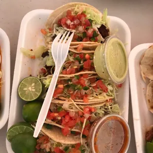 5 tacos de (of) adobada. Marinated pork