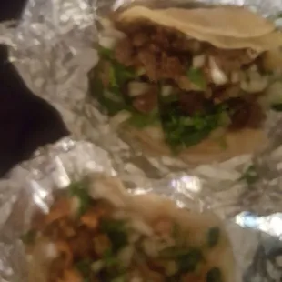 Carne and pollo tacos, packed with meat