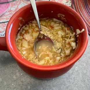 a bowl of soup with a spoon in it