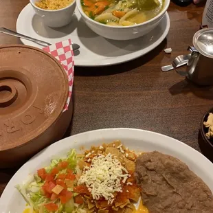 Cheese omelette, beans &amp; chips on salsa. Caldo de pollo with rice. I got flour tortilla &amp; my husband got corn tortilla.