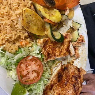 Grilled chicken with roasted veggies and rice. It's one of my fave dishes. It's packed with flavor