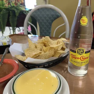 Refreshing topochico and small Chile con queso
