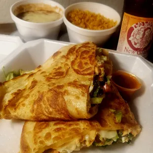 Quesadilla with chicken, sides of rice and bean (New Glarus Brewing Two Women Lager from nearby Walmart)