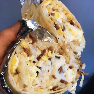 Bacon breakfast burrito with hash brown, cheese &amp; sour cream