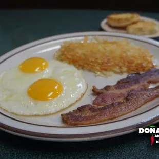 2 Eggs, 2 Bacon strips, Hash Browns and Biscuit