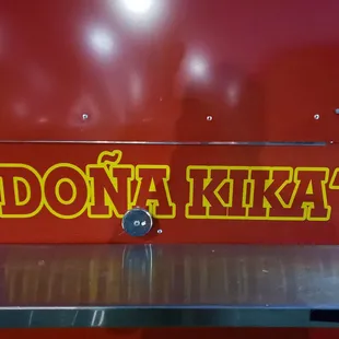 a don't kika's logo on the side of a red