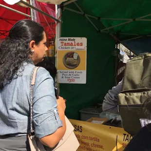 a woman at a food stand
