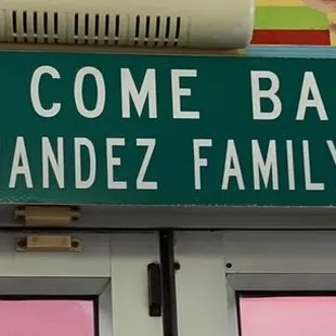 a street sign on the side of a building