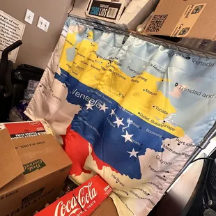 a map of venezuela and a carton of coca cola