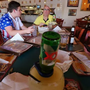 two men sitting at a table