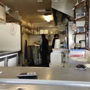 two people in a commercial kitchen