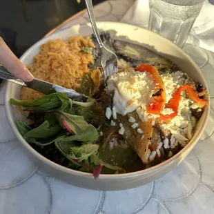 a plate of food with rice and vegetables