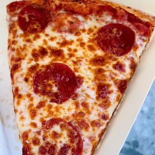 Pepperoni pizza slice.