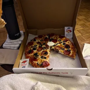 Custom pepperoni and black olives.