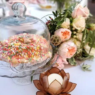 We displayed our wedding donut from Donald&apos;s under a glass dome.