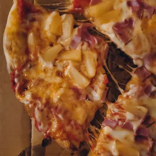 a half eaten pizza in a box