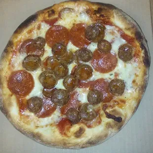 a pepperoni pizza in a box