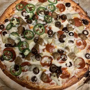 The best Cauliflower Crust around.Custom pizza-jalapeño,black olive,pepperoni,sausage and artichoke hearts.Straight