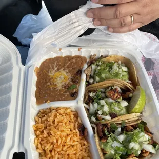 Three street tacos meal: chicken, pork, beef