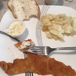 Bread, fish, tartar sauce and baked potato
