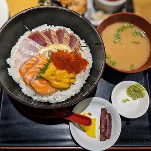 a bowl of sushi and a bowl of soup