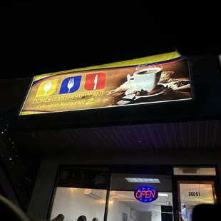 the front of the restaurant at night