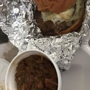 Hamburger with jack cheese, slaw and a side of baked beans