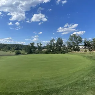 The 18th green plays up a rise to a beautiful green that looks back out over the great course !