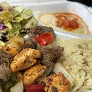 Combo meal. Amazing beef and onions/bell peppers, mildly flavorful chicken, creamy hummus, and pickled salad.