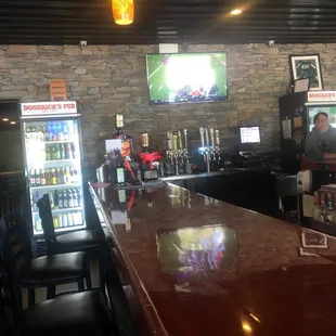 a bar with a large television