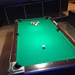 a pool table with a pool ball on it