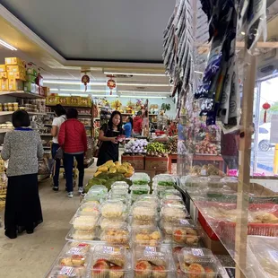 people shopping in a grocery store