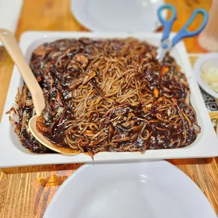 a plate of food with a spoon in it