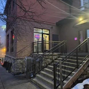 Walk up the stairs to the rear entrance