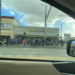 people waiting to cross the street