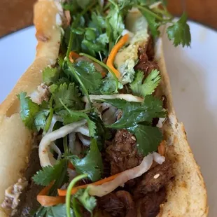 Vegan beef + Pâté  on my Bánh mì. The bread is always fresh baked and there's cameras showing the back bakery area.